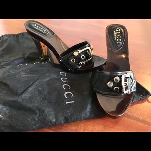 Gucci slide sandals with logo.